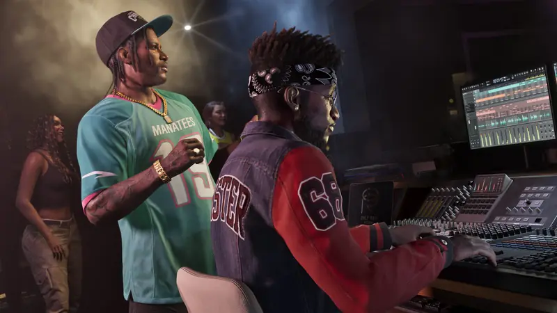 Two men in sports jerseys work a mixing desk in a recording studio