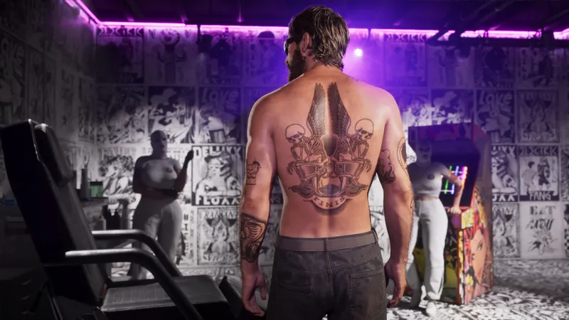 A shirtless man shows off a large back tattoo inside a tattoo parlour