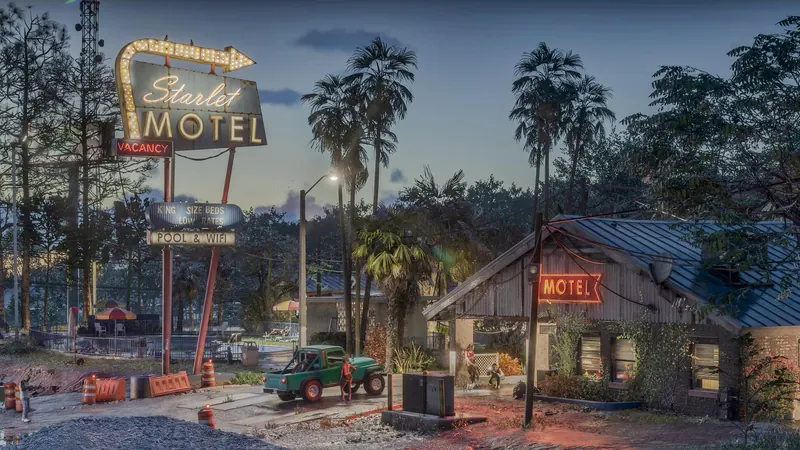 The neon Starlet Motel sign at dusk on Historic Route 628