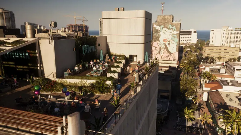A packed rooftop bar overlooking the streets of Vice Beach and the ocean