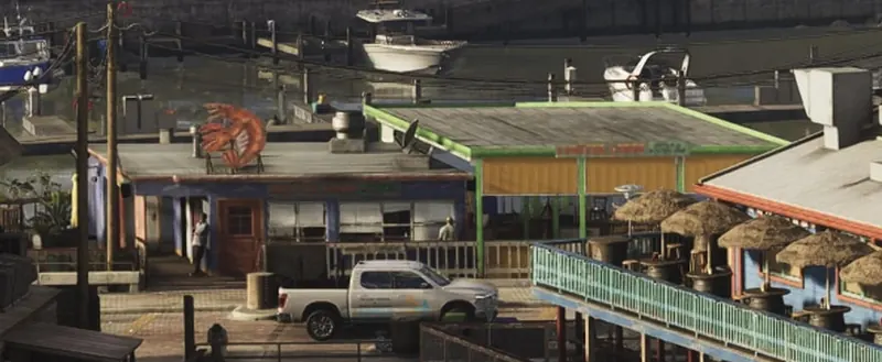 A waterfront bar and grill in Watson Bay with a pickup truck parked outside